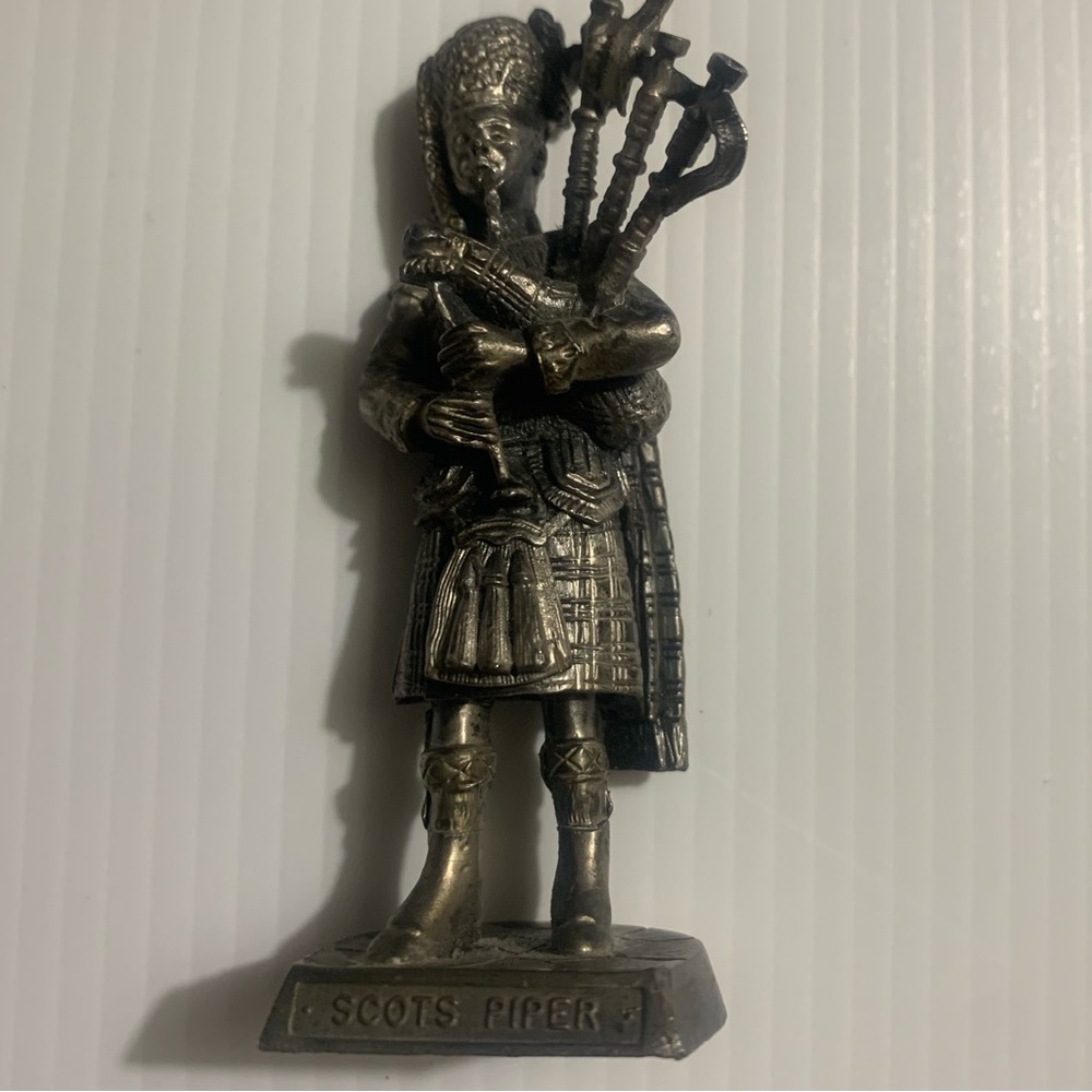 Silver Scots Piper Figurine. I believe it's made of pewter  Scot's piper 3.5"